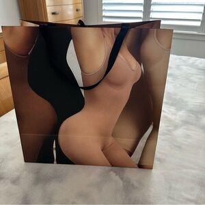 Skims Stylish Shopping Bag with Artistic Design